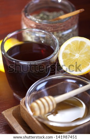 Tea cup with lemon and honey