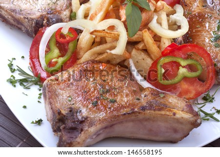 Fried pork chops and vegetables