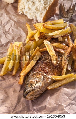 fish and chips served with bread as fast food
