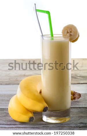 fresh banana smoothie on old rustic table