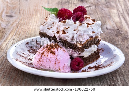 Sweet summer cake with ice cream and raspberries