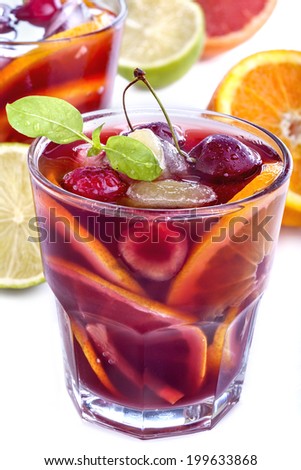 Sangria with citrus and other fruit on a white background