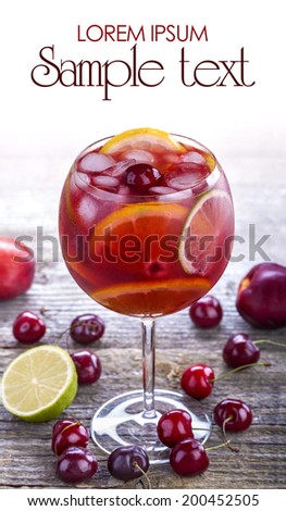 ice refreshing summer drink with lots of different fruits