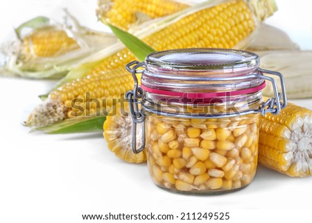 glass jar filled with sweet canned corn