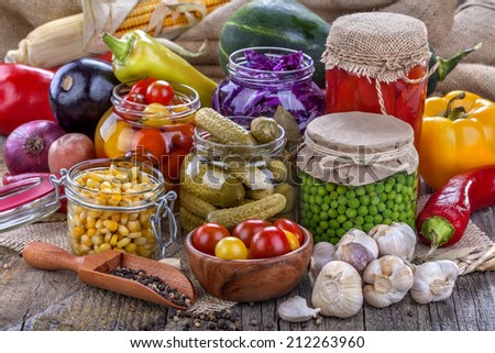 Several kinds of healthy domestic canned vegetables in jars