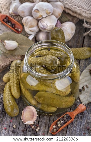 canned and preserved fresh homemade pickles in glass jar