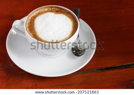 A Latte Coffee with swirls of creamy milk and espresso.