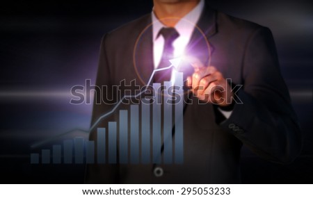 Businessman standing posture hand touch graph finance