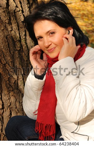 listening to the music outside near a tree