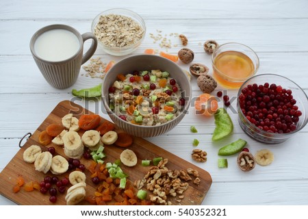 Healthy eating. Oatmeal with fruit and candied fruit