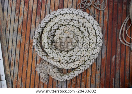 Boat rope in tidy spiral coil on desk