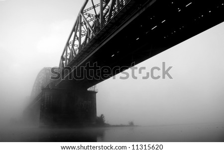 Bridge disappearing in fog