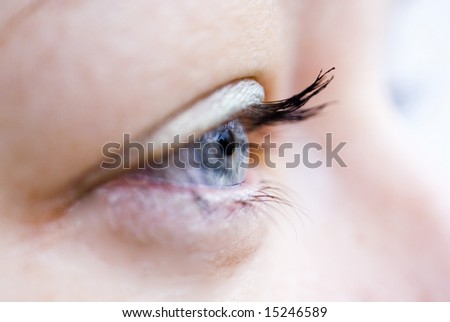 Side view of woman\'s blue eye