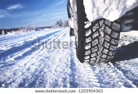 Closeup of car tires in winter morning