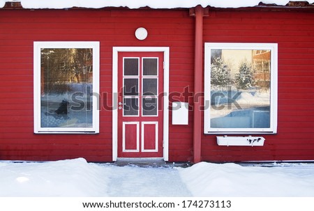 Red door in wintertime