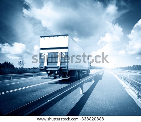 tilt truck moving on the asphalt road