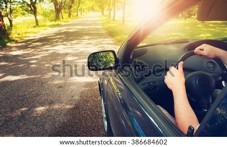 Car on asphalt road in summer