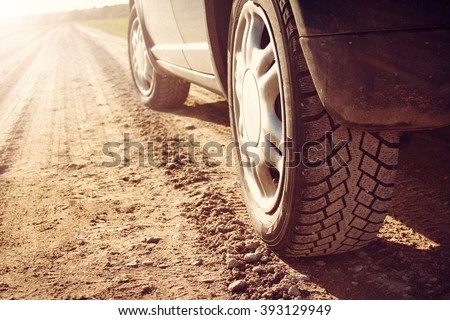 car tire on dirt road