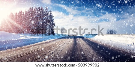 Car on winter road covered with snow