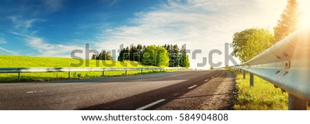 asphalt road panorama in countryside on sunny spring evening