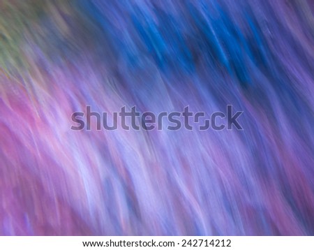 Abstract background from motion blur of colorful lighting in aquarium.