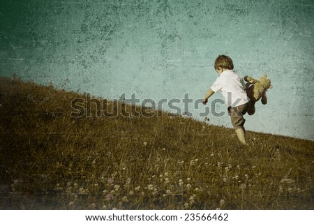 young boy climbing hill