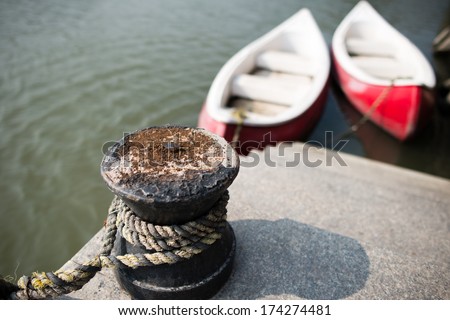 The bollard tied in the harbor