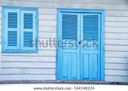 Beautiful blue colored wooden window and door in a house