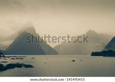 Black and white mountain, lake, lagoon with cloud and rain. Traveling in New zea-land