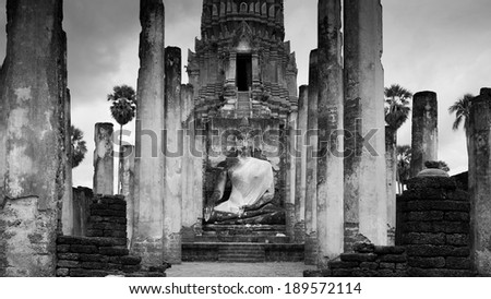 Black and white ancient, heritage, temple, building with lord of Buddha statue and cloud sky