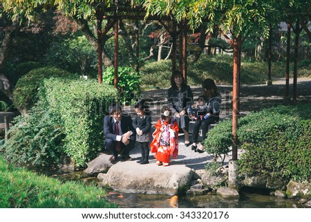 JAPANESE FAMILY, SAGA, KYUSHU, JAPAN - 23 NOVEMBER 2014 : Unidentified Japanese family activity in temple.