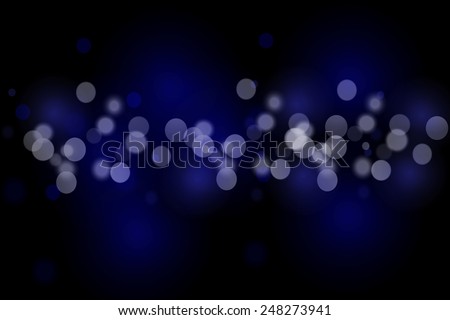 blue and white bokeh on black background