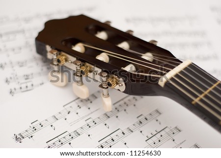 Guitar and music notes in opened music note book