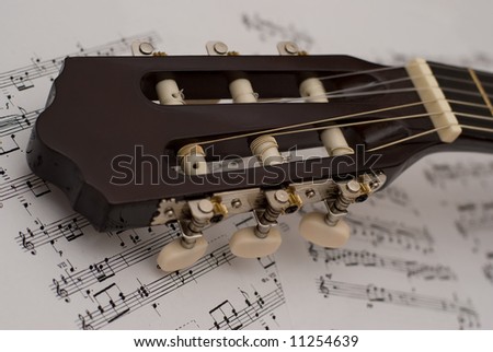 Guitar and music notes in opened music note book