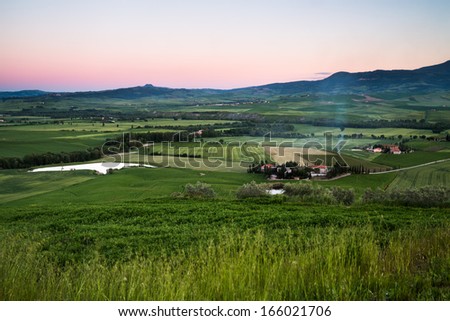 Green fields at the sunset in Toscana, Italy