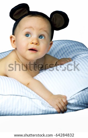 Beautiful baby on pillow  isolated on white