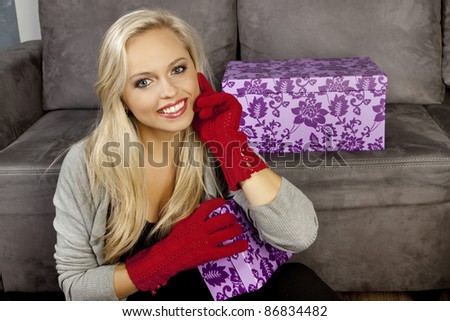 portrait of attractive young woman with gift pack