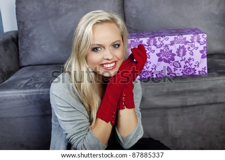 portrait of attractive young woman with gift pack