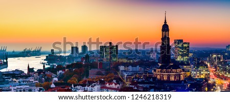 Panoramic aerial view of the harbor, St. Michael's Church (German: St. Michaelis) and downtown Hamburg, Germany.
