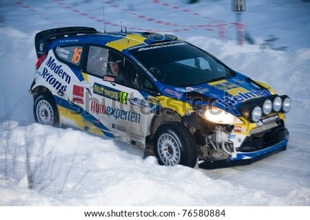 HAGFORS, SWEDEN - FEB 12: Per-Gunnar Anderson drives a Ford Fiesta RS during the World Rally Championship event Rally Sweden 2011 in Hagfors, Sweden on February 12, 2011
