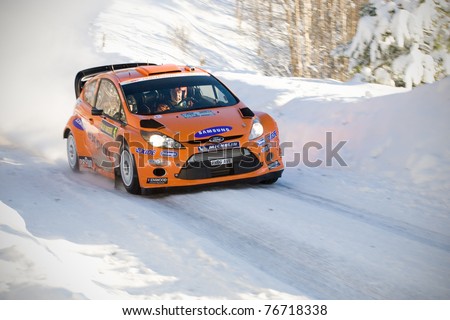 LYSVIK, SWEDEN - FEB 11: Henning Solberg driving his Ford Fiesta WRC during the World Rally Championship event Rally Sweden in Lysvik, Sweden on Feb 11, 2011