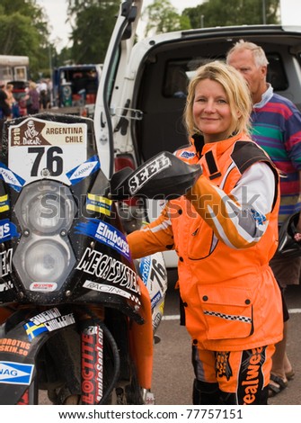 ARLSTAD, SWEDEN - JULY 16: Dakar Motorcylce rider Annie Seel, winner of the Ladies Trophy Dakar 2010, arrives in the service park at the Midnattsolsrallyt event in Karlstad, Sweden on July 16, 2010