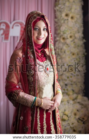 Happy young islamic woman portrait in the room , at a celebration ceremony