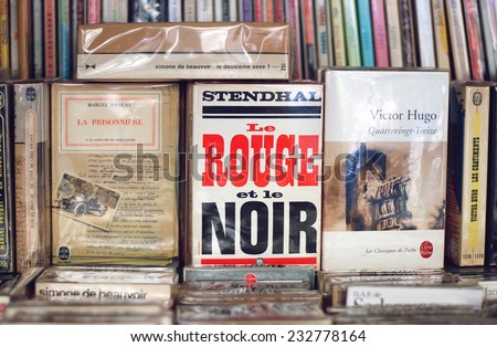 PARIS, FRANCE - AUGUST 18, 2012: Old books for sale at flea market in Paris
