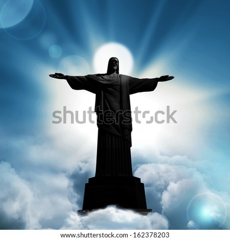 jesus christ,brazil  statue blue sky clouds background
