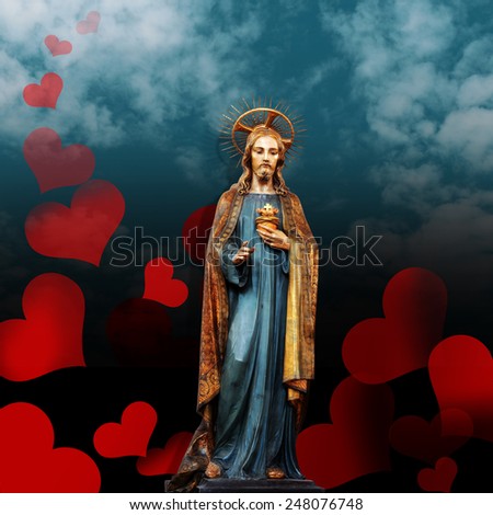 jesus christ statue,hearts,clouds and sky background