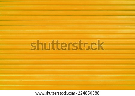 Close up orange metal sheet slide door texture background.
