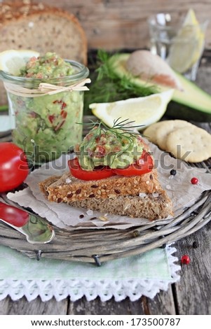 Fresh sandwich with avocado dip and tomato