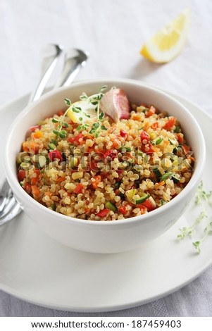 Quinoa salad with vegetables,herbs and lemon.