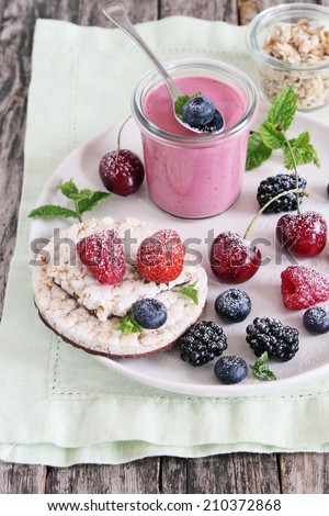 Healthy breakfast with dietary rice waffles, berry yogurt and fresh berries.Selective focus.